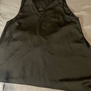 sleeveless top, with the metal ring in the middle, black. Asymmetrical top